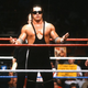 Bret “Hitman” Hart circa 1986 with manager Jimmy Hart and tag team partner Jim “The Anvil” Neidhart.